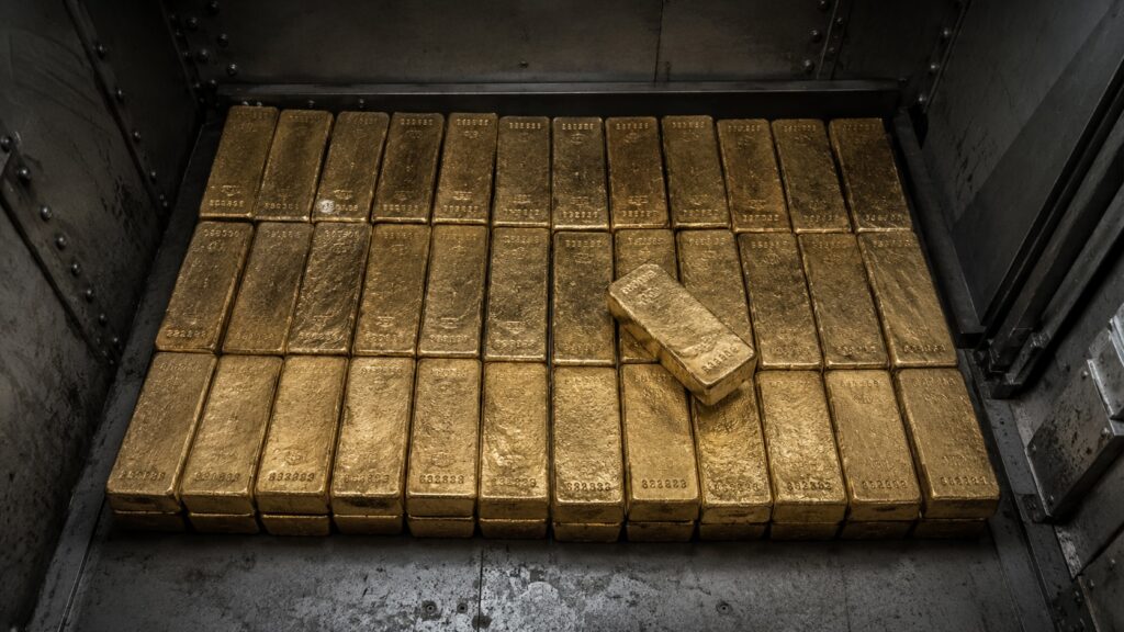 Gold bars stacked in a Swiss bank vault — the Swiss National Bank received $440 million in Nazi gold during World War II according to the Bergier Commission, over half of which was looted from occupied countries and Holocaust victims