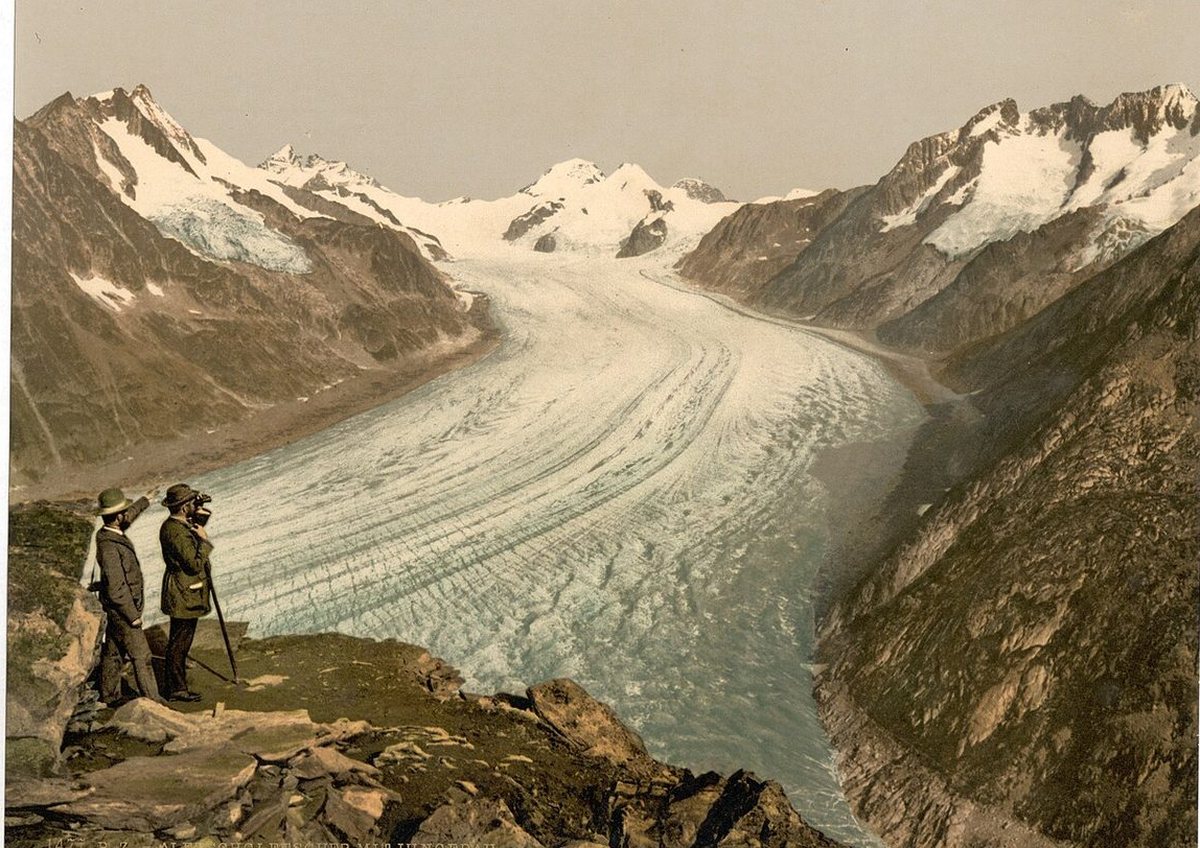 1890s photochrom of two travellers on the Eggishorn looking down the Aletsch Glacier towards the Jungfrau, Mönch and Eiger