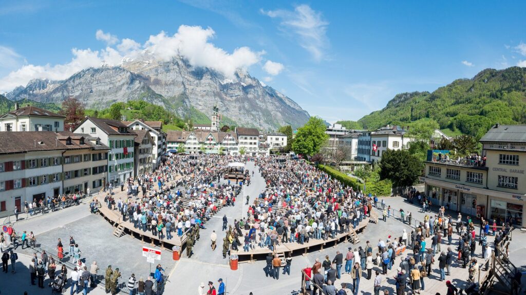 Swiss direct democracy in action: thousands of citizens gather for the Landsgemeinde open-air vote in Glarus