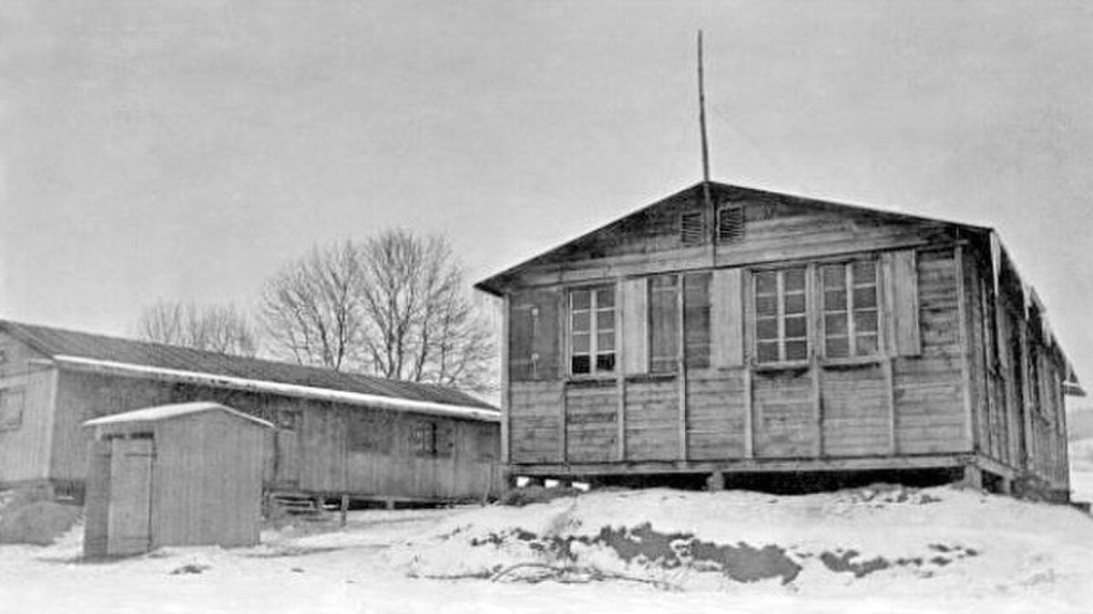 Wooden barracks of the Wauwilermoos punishment camp in snow, probably winter 1944–45