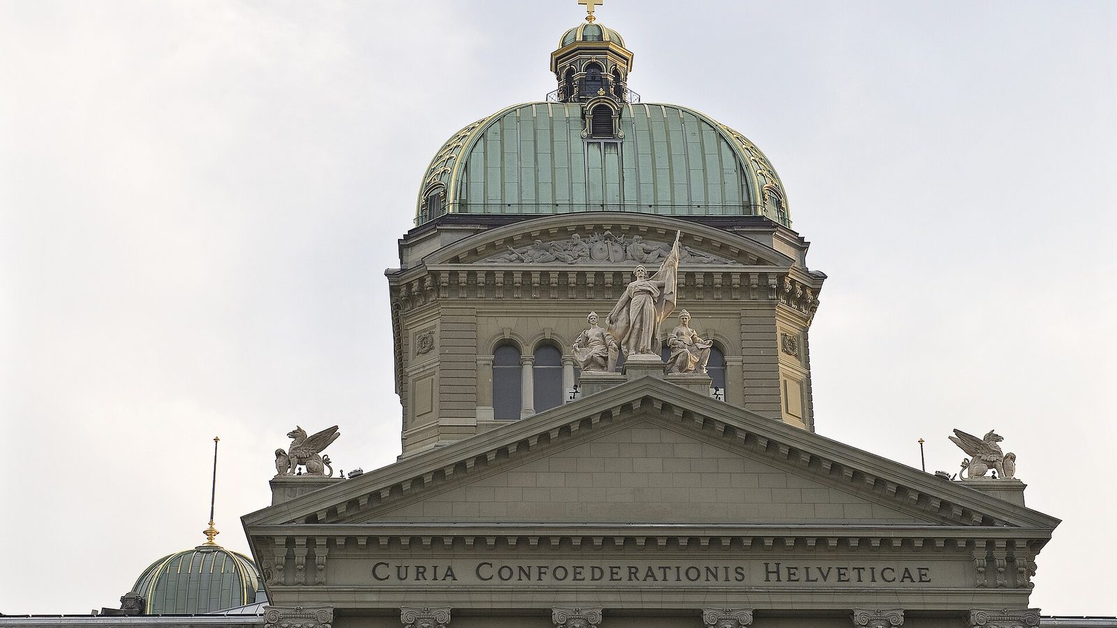 Federal Palace in Bern with the Latin inscription Curia Confoederationis Helveticae, the source of Switzerland's CH code